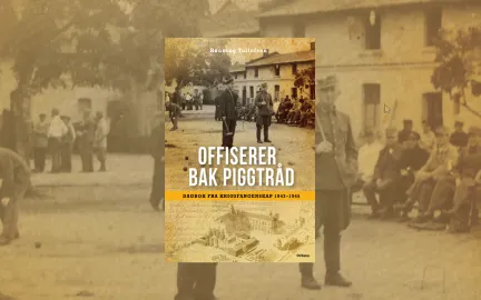 offiserer bak piggtråd